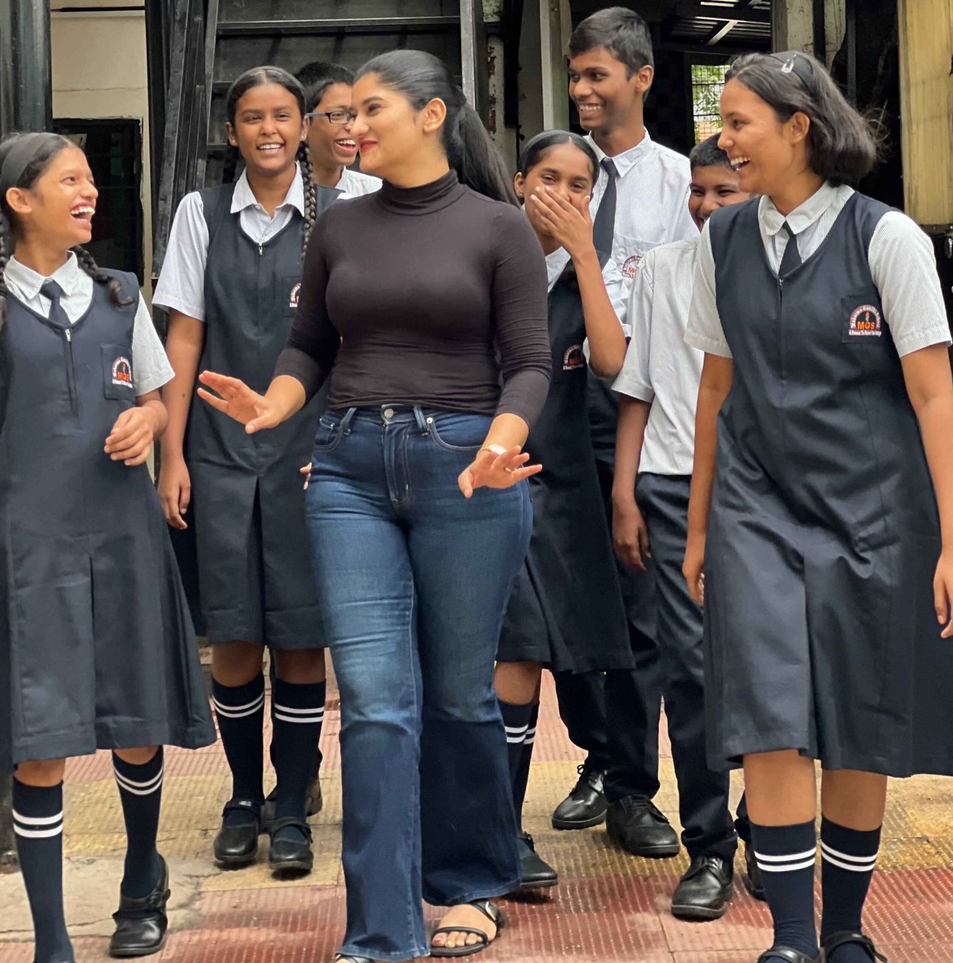 Students sharing a moment with a visitor at MGS