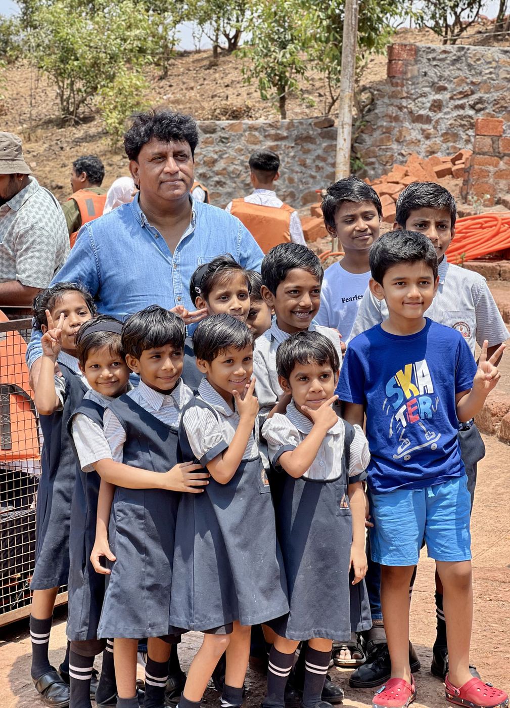 Founder with young students on an outdoor visit